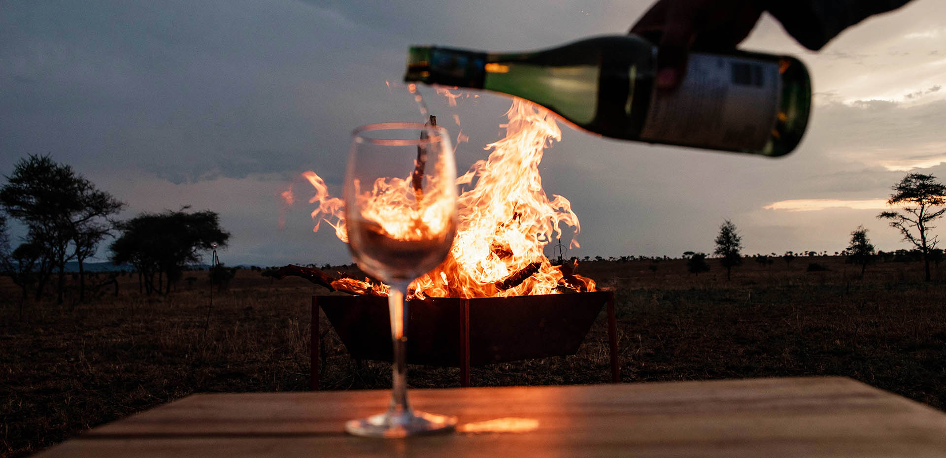 Luxury Serengeti safari experience with golden sunrise, wildlife, and grasslands at Manya Luxury Camps